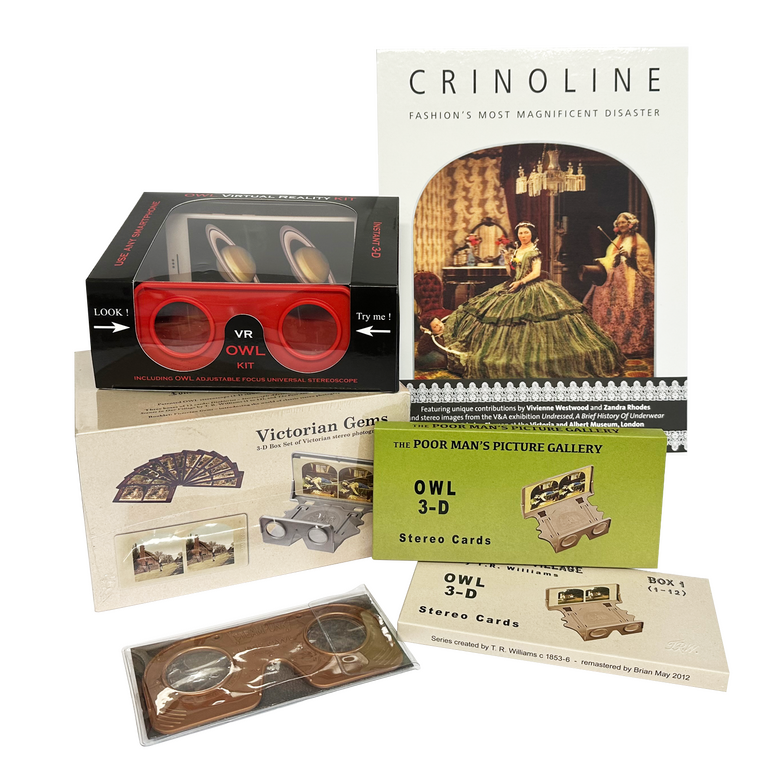 Product photograph of a group of stereoscopy-related items. It features a book about crinoline, two different types of stereo viewers, and a box of stereoscopic photographs.