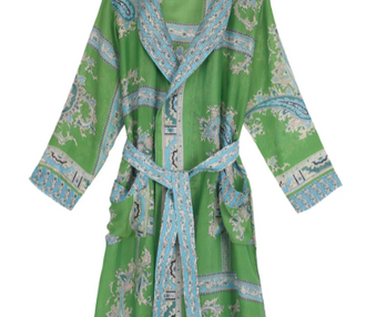 A long green gown with blue patterns and a waist tie