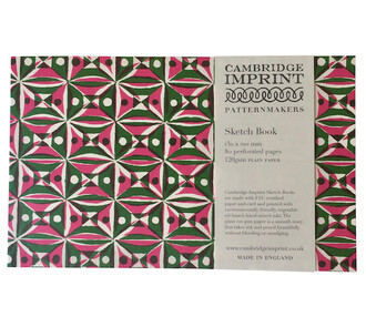 A sketchbook made by Cambridge Imprint with a colourful red and green pattern on the front cover