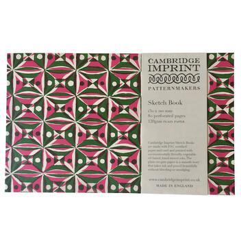 A sketchbook made by Cambridge Imprint with a colourful red and green pattern on the front cover