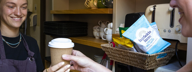 Customer buying takeaway hot drink at Tea Shop at Watts Gallery