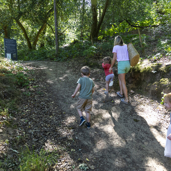 A family walk up the slope into the Verey Playwood