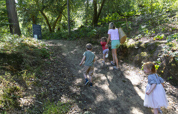 A family walk up the slope into the Verey Playwood