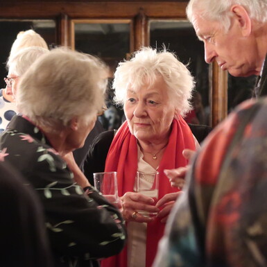 Guests chat with drinks in hand