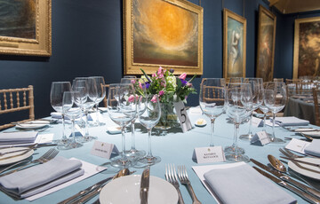 Table laid with flowers in middle