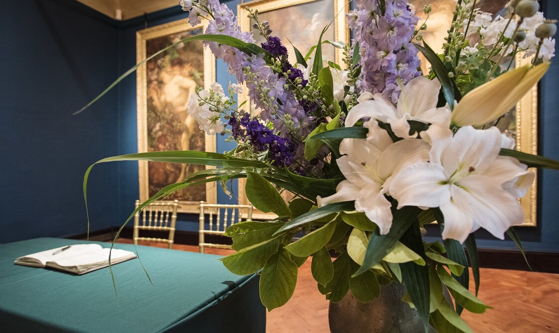Lilies in vase set up for wedding ceremony